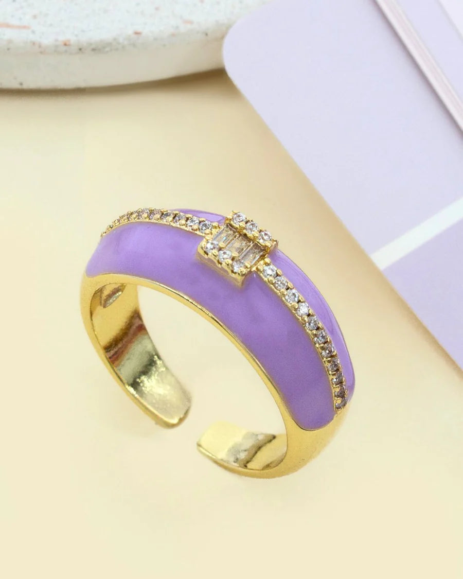 A purple enamel and gold-colored ring with zirconia stones