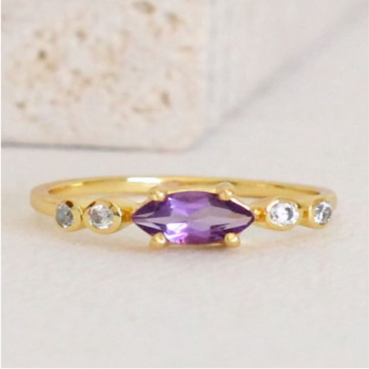 Gold ring with marquise-cut purple amethyst and crystal accents