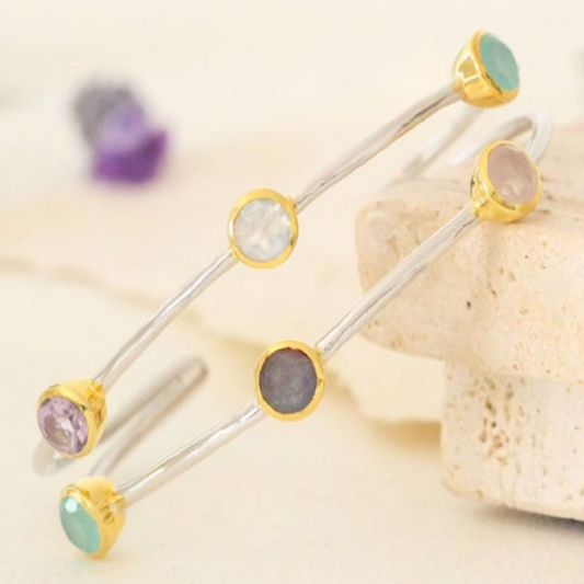 Adjustable rhodium plated cuff bracelet with labradorite, moonstone, aqua hydro quartz, and amethyst in gold bezel settings